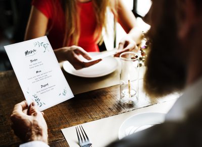 Man reading dinner menu