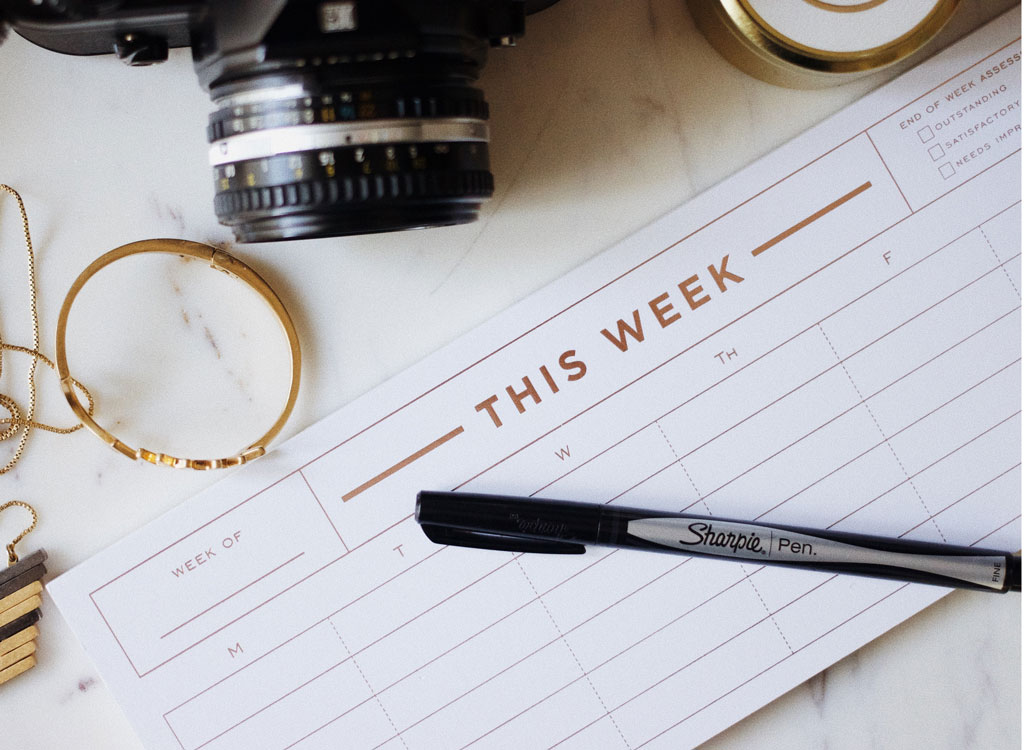 Weekly planner with pen and camera