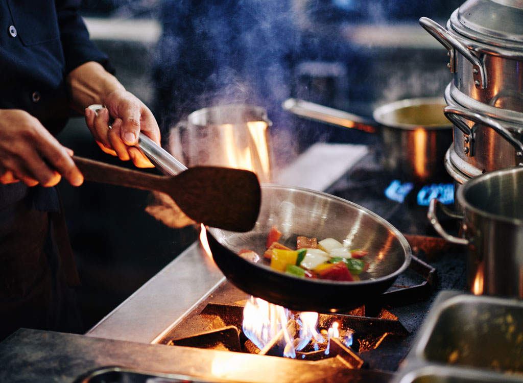 Vegetables sauteing in pan