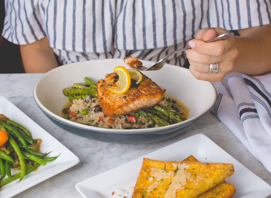 Woman eating salmon