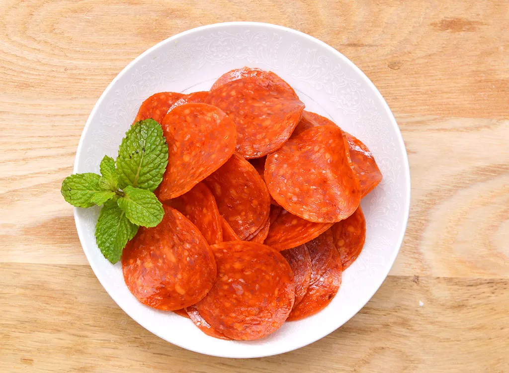 Bowl of pepperoni basil garnish