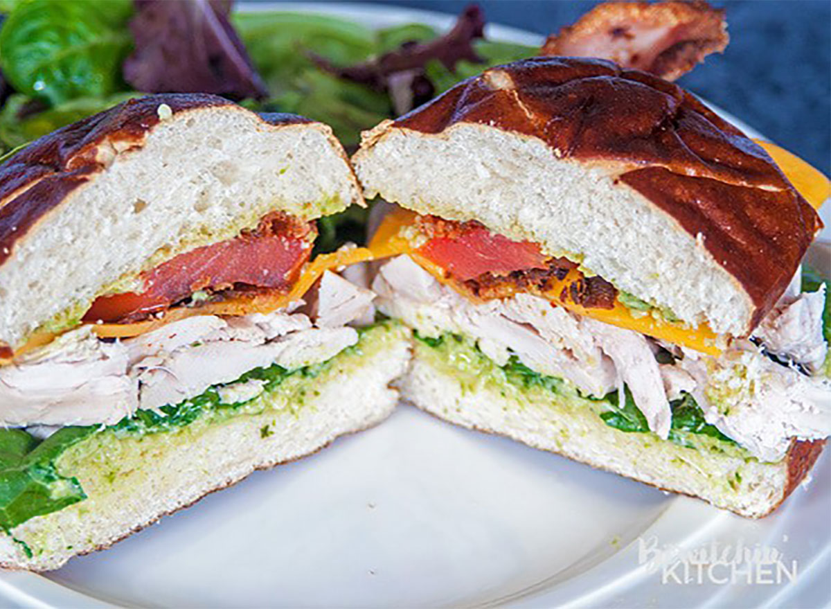 chicken club sandwich on pretzel bun