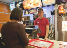 Fast food worker taking order