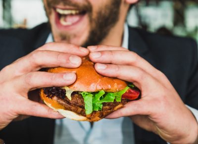 Man eating burger