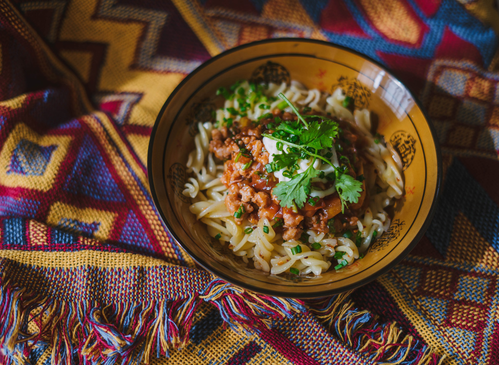 Rotini pasta with meat sauce and cilantro