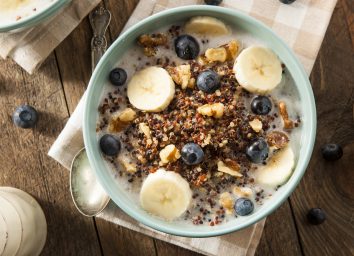 Breakfast quinoa bowl with bananas and blueberries