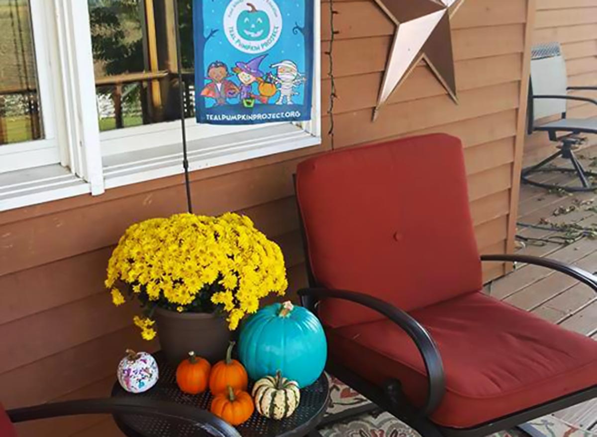 Teal pumpkin project on front porch