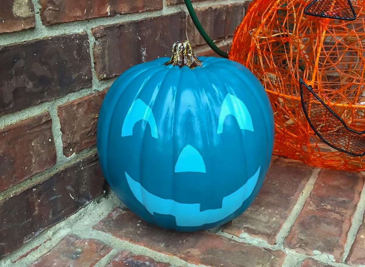 Teal pumpkin project painted jack o lantern