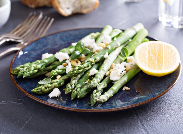 Asparagus with cheese and lemon and pine nuts