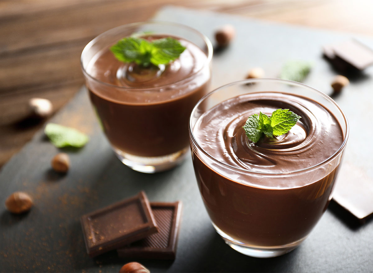 chocolate pudding cups topped with mint leaves