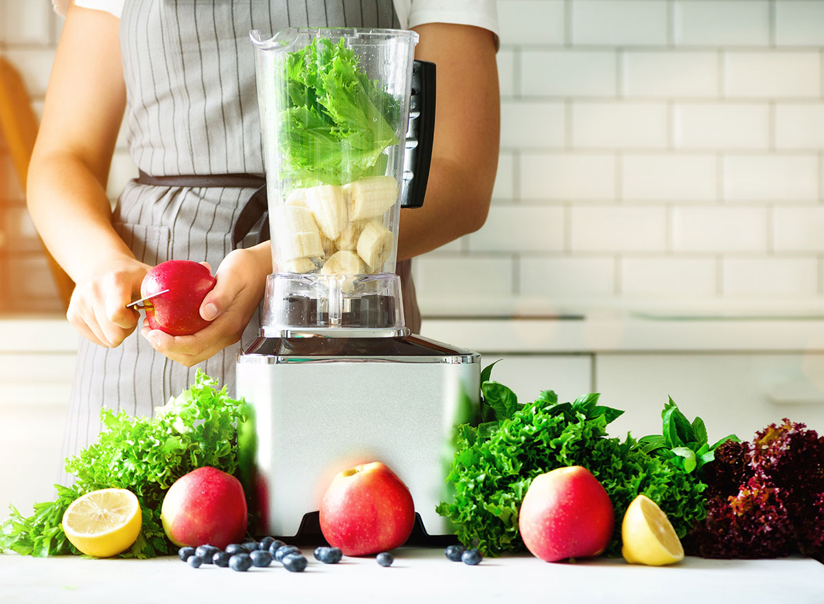 cutting apples and lettuce for blender