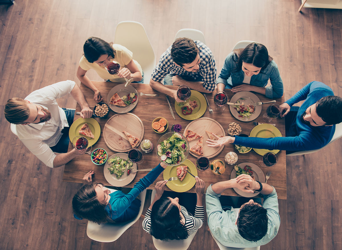 Friends seated around table