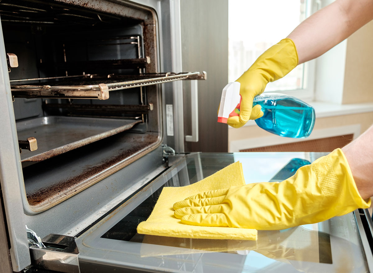 Hands cleaning oven