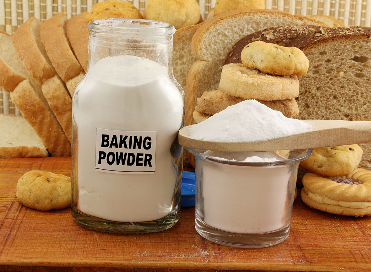 Baking powder in jar surrounded by bread products