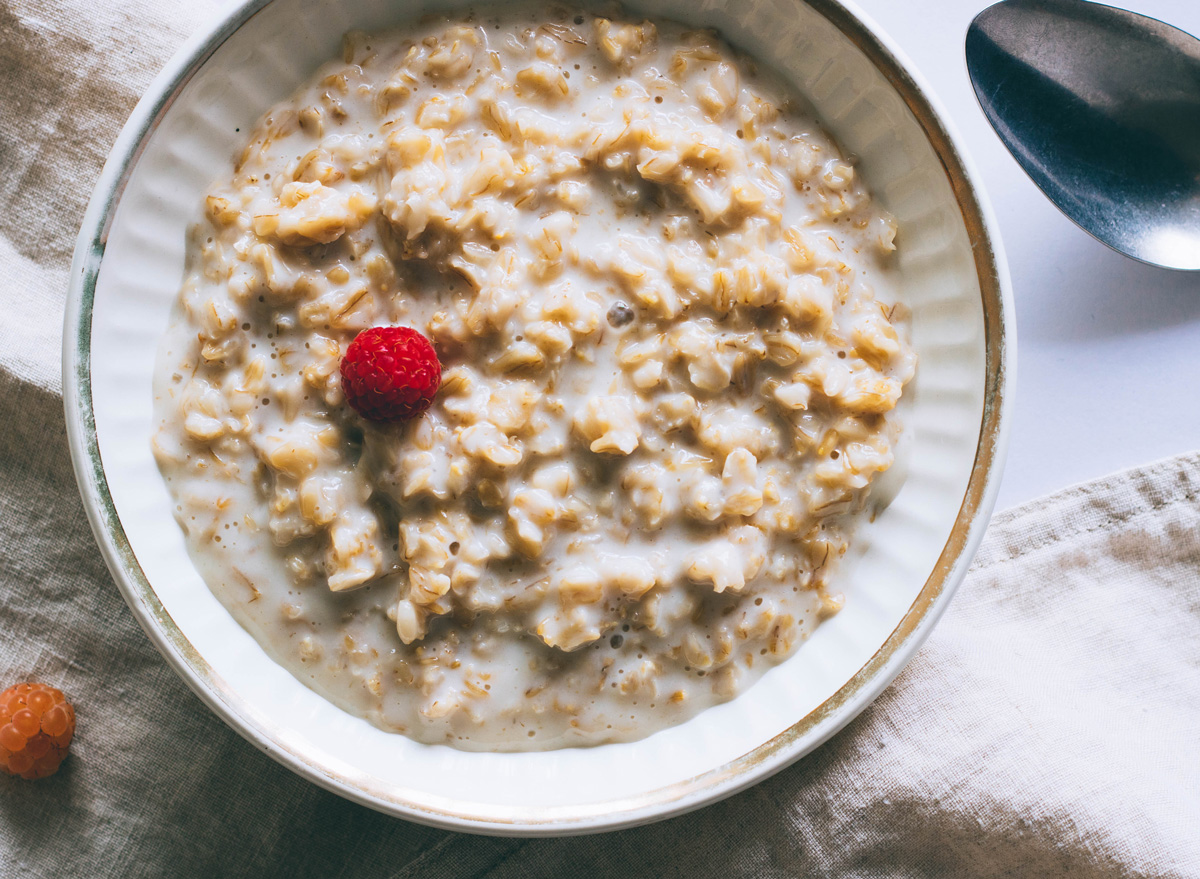 Bowl of plain oatmeal with milk for breakfast