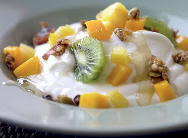 Gluten free yogurt with pineapple kiwi mango and ginger syrup