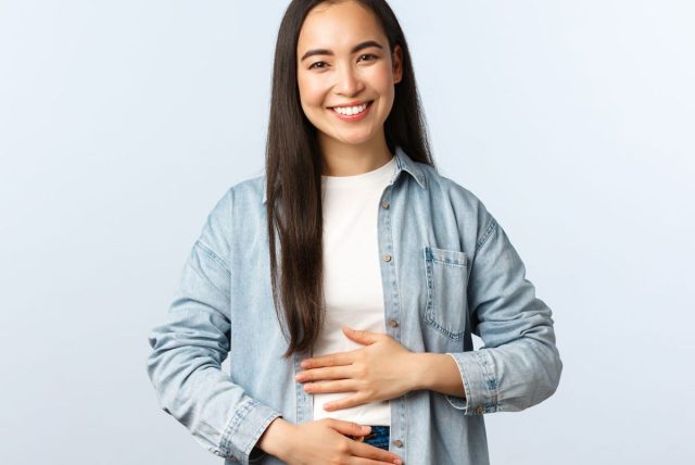 happy woman hands on belly