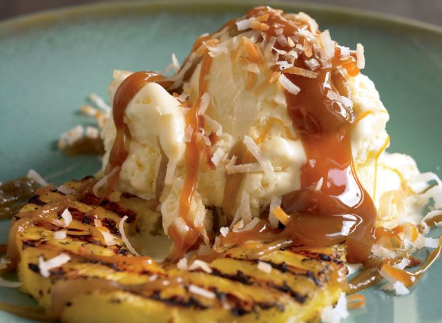 Sundae with grilled pineapple and rum sauce
