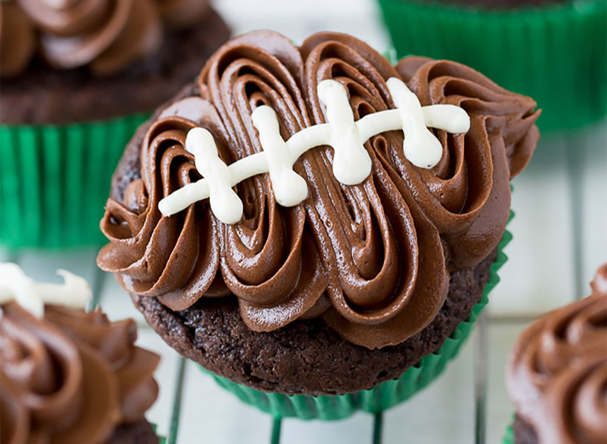 football shaped cupcake with chocolate frosting