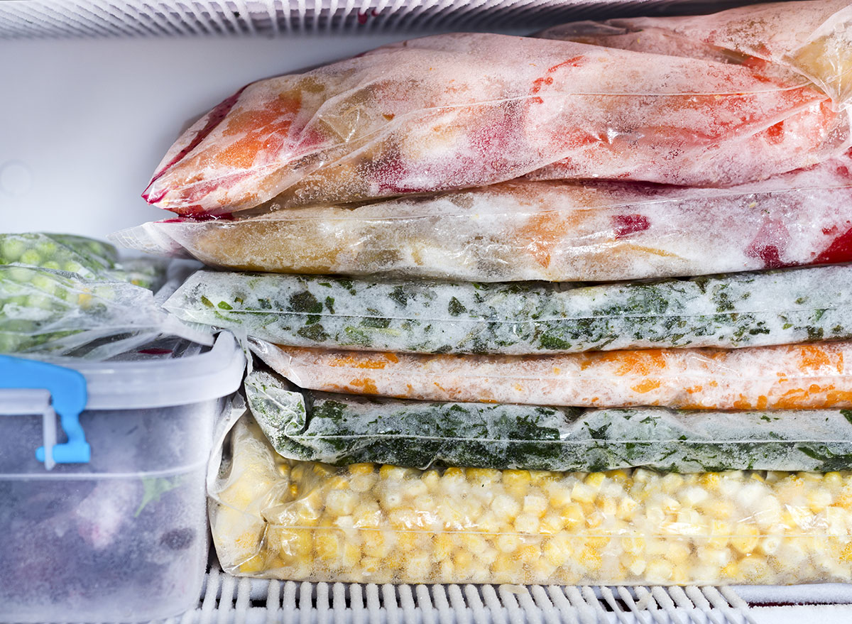 Frozen foods in bags on freezer shelf