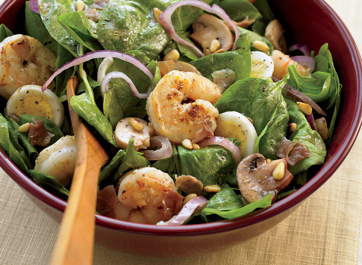 Healthy spinach salad with warm bacon dressing