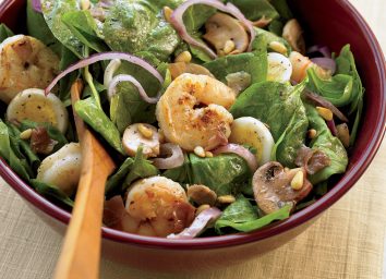 Healthy spinach salad with warm bacon dressing