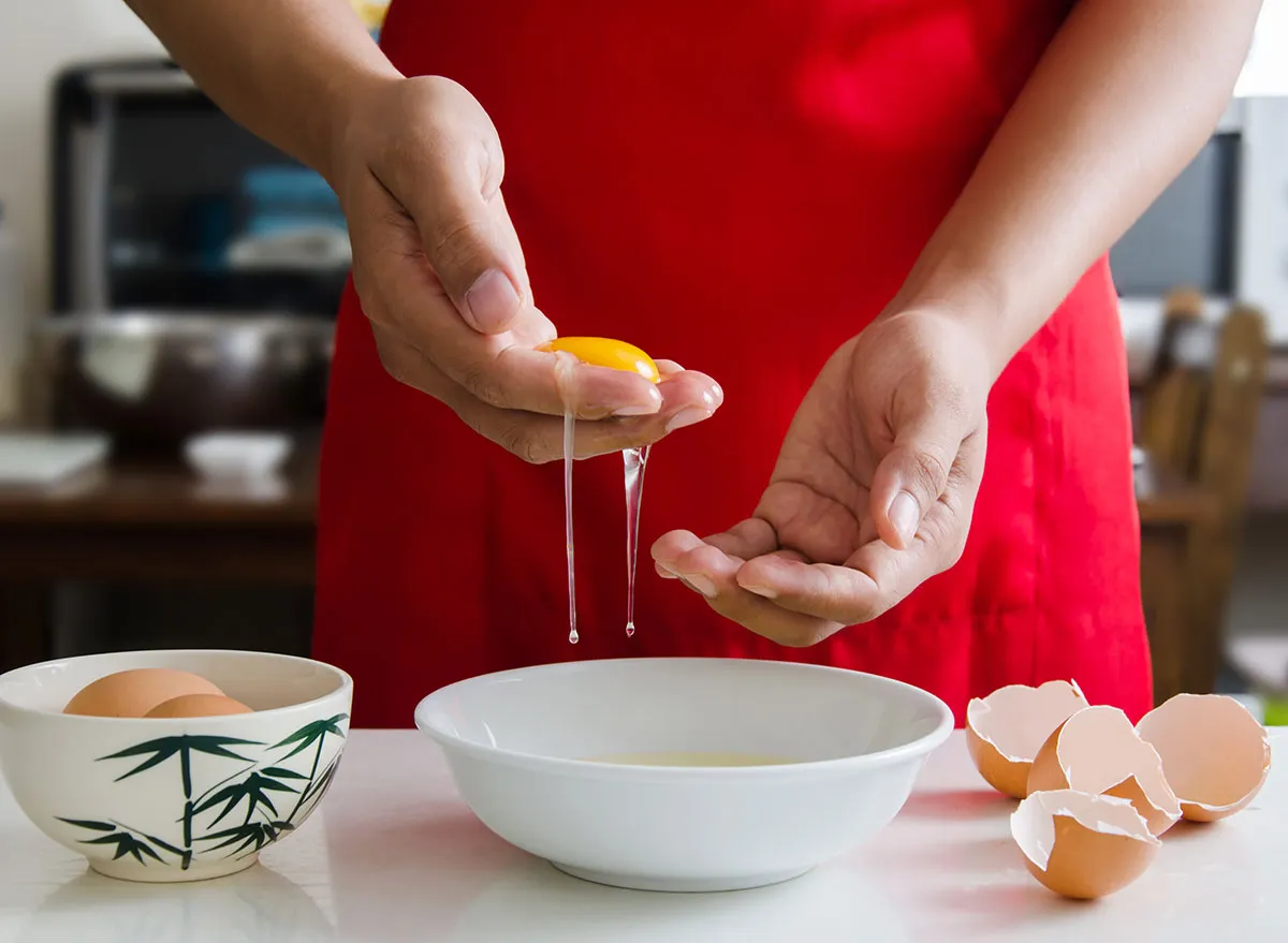 Separating egg whites with hands