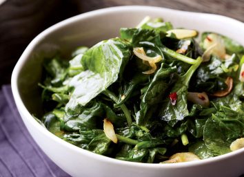 Vegan garlic lemon spinach in a bowl