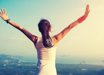 woman-looking-at-landscape-in-workout-gear