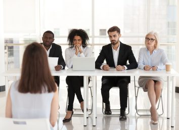woman interviewing for job in front of panel