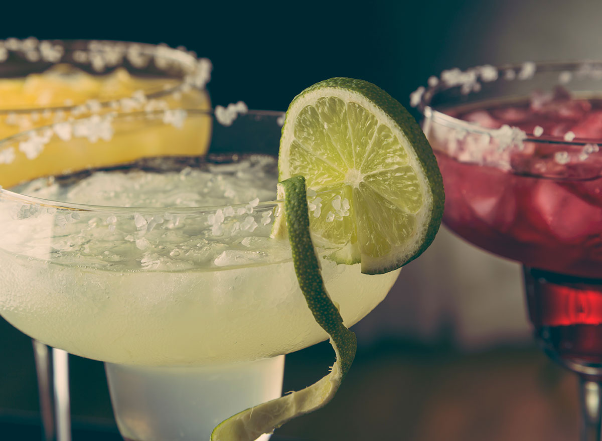 assorted margarita cocktails with salt on rim