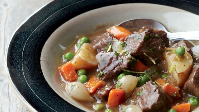 Beef stew recipe in black lined glass bowl