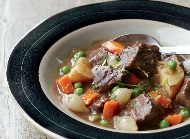 Beef stew recipe in a black lined glass bowl