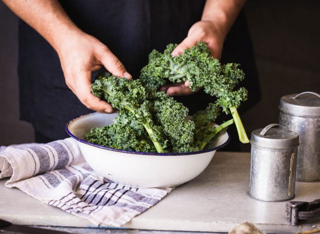 Kale dark leafy greens hand massaged in bowl