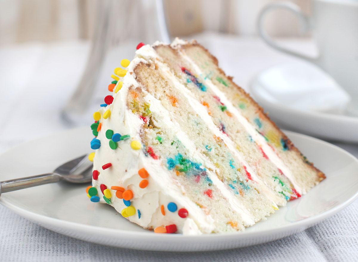 Funfetti cake slice on plate with spoon