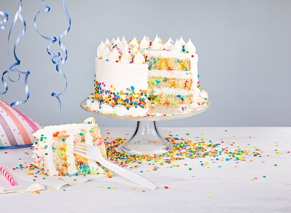 Funfetti cake with slice cut out with fork