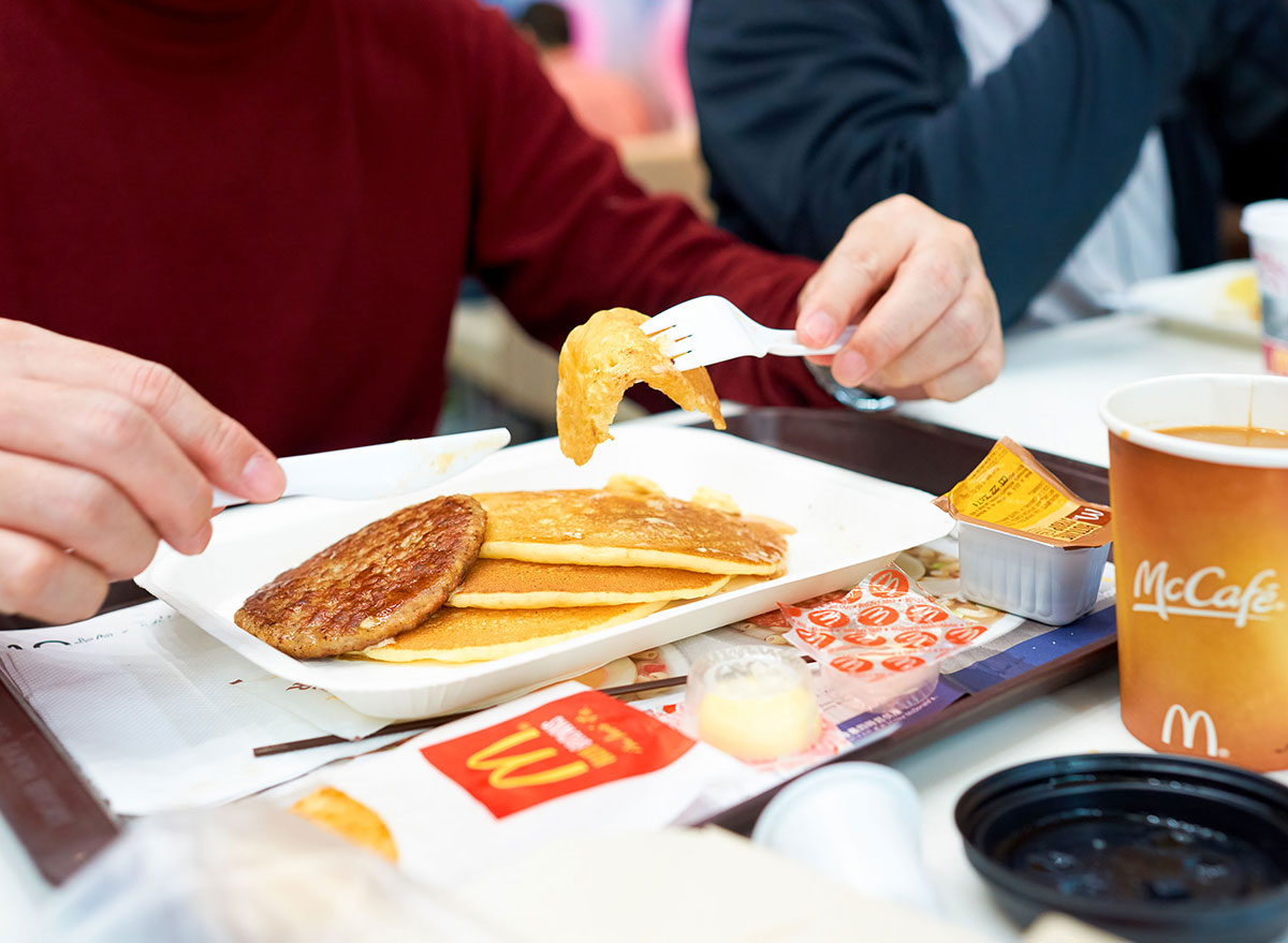 mcdonalds breakfast pancakes with sausage coffee on tray