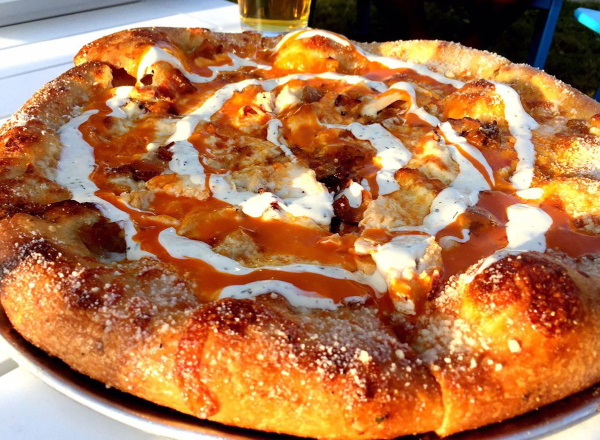 mellow mushroom buffalo chicken pizza with ranch and buffalo sauce swirl