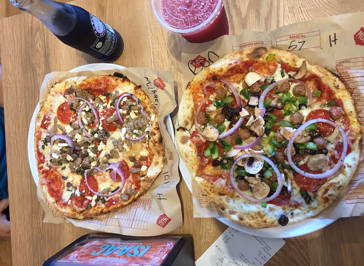 mod pizza with sausage and onions