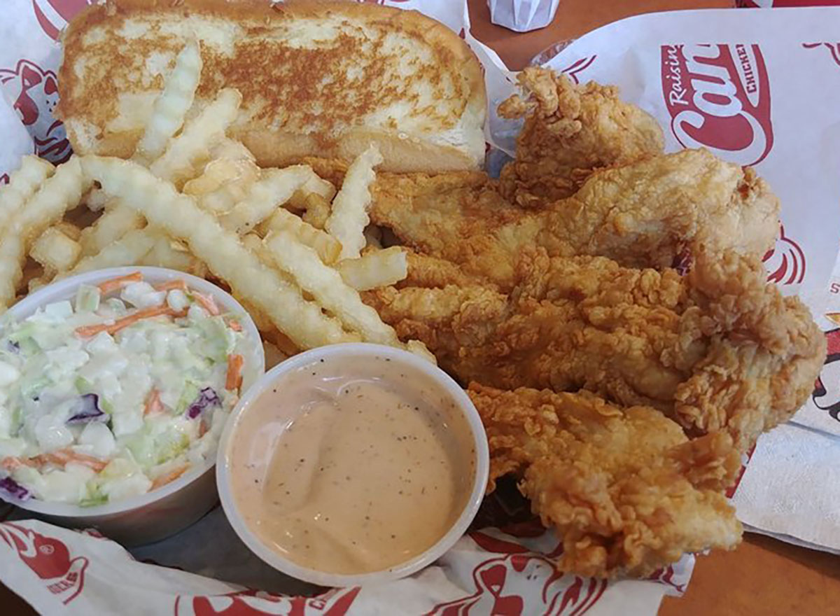 raising canes chicken tenders and fries with coleslaw and dip
