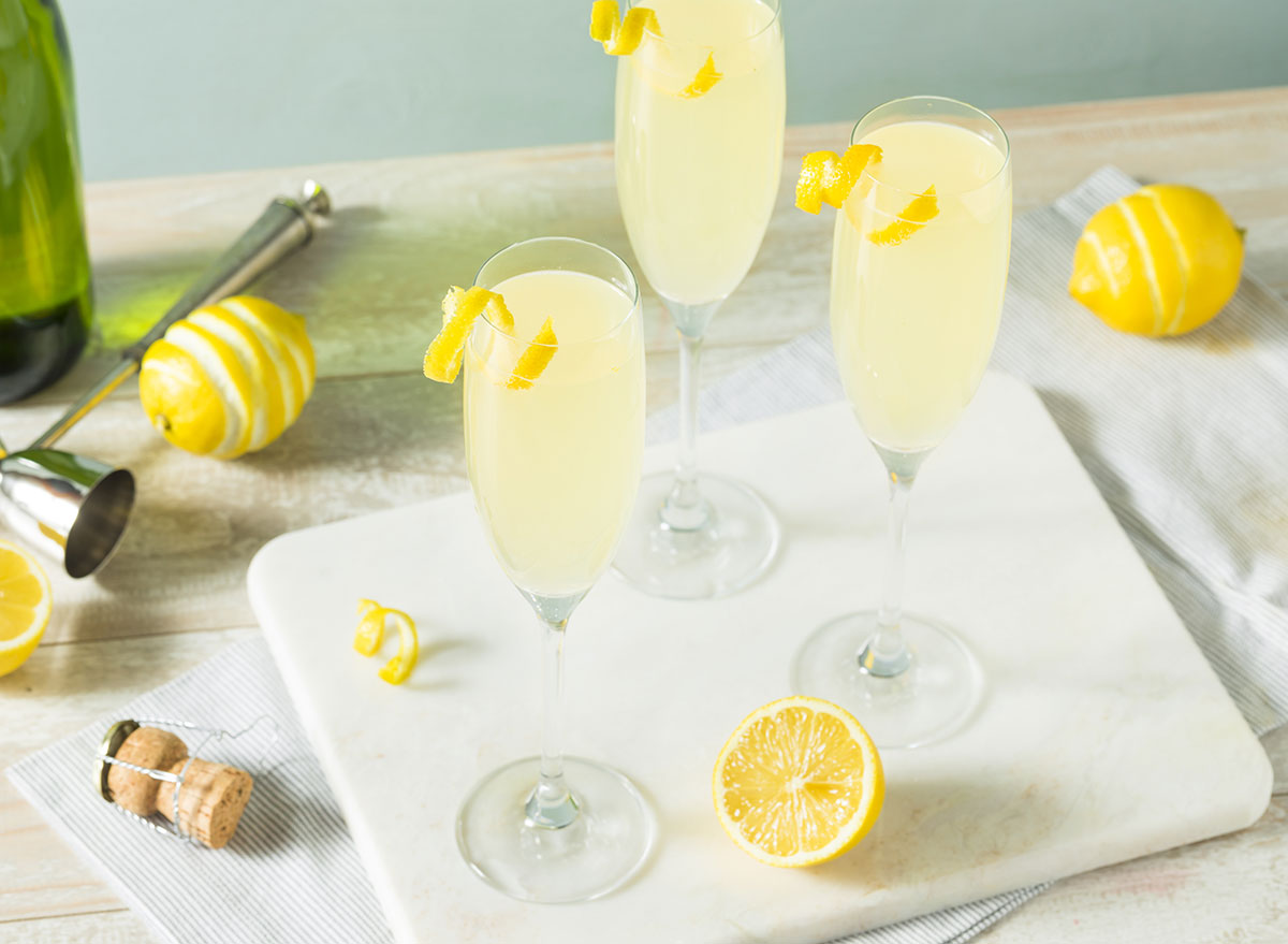 the french 75 cocktail in champagne glasses