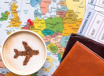 coffee cup on map with passport food destination