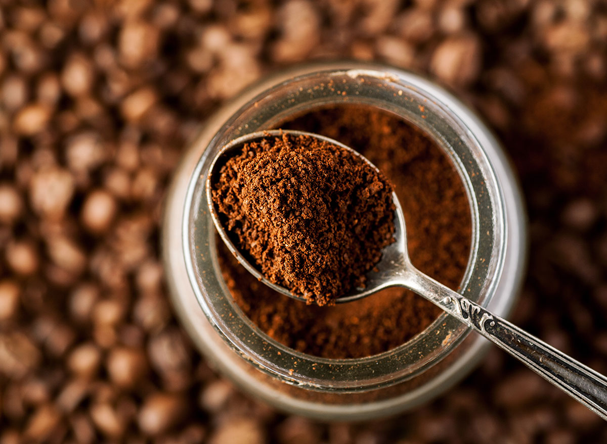 coffee grounds on spoon from jar