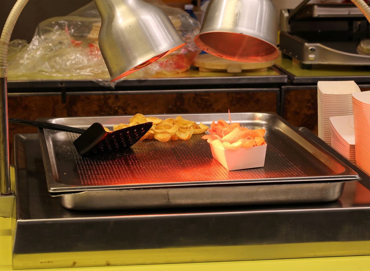Food french fries under heat lamp