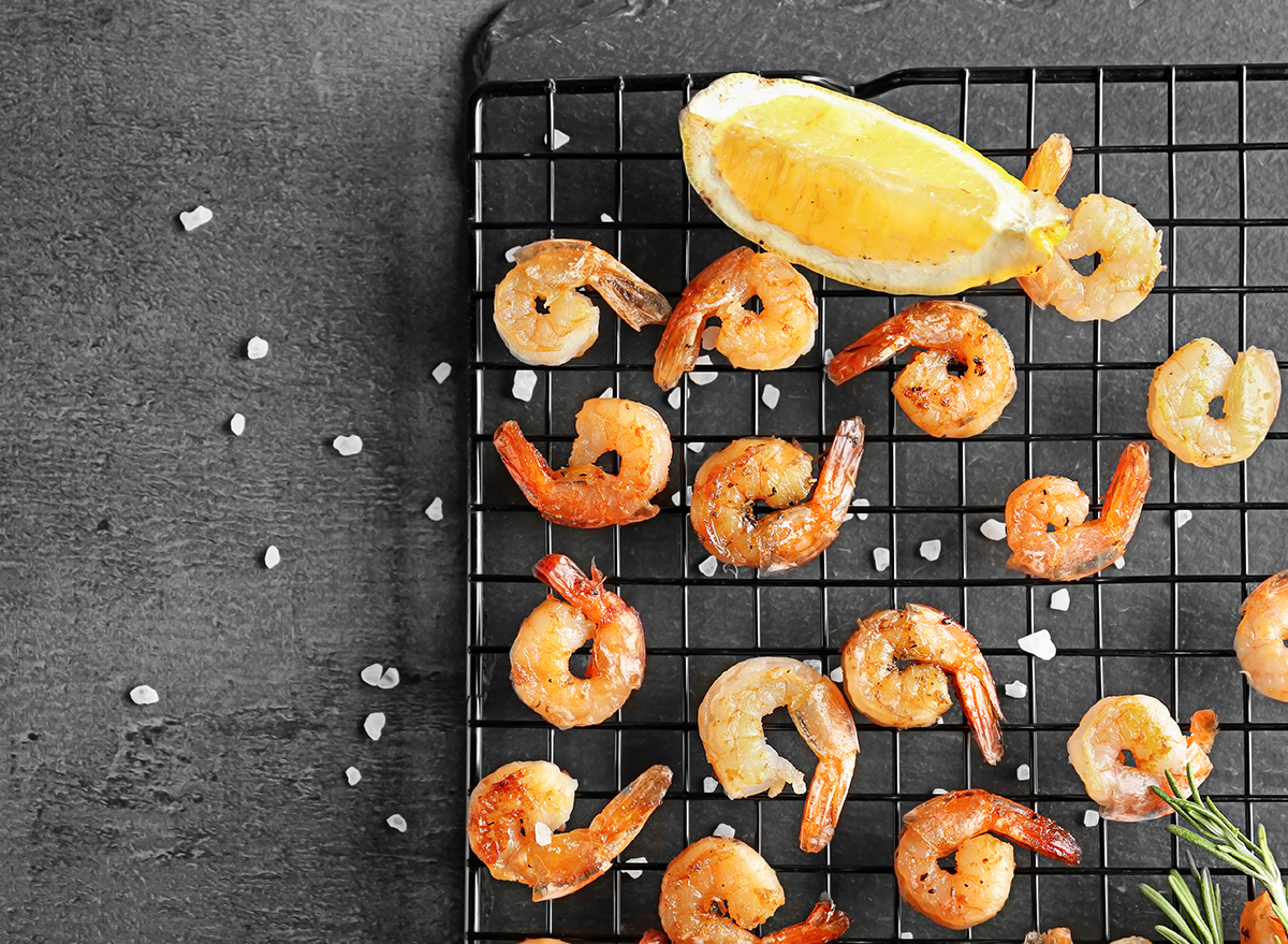grilled shrimp on cooling rack with lemon wedge and sea salt