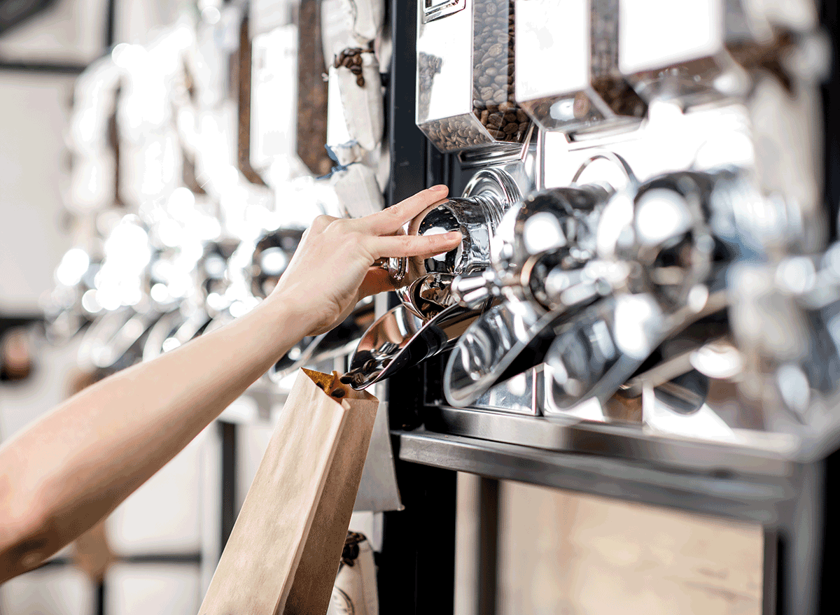 filling coffee beans at filling wall in grocery store