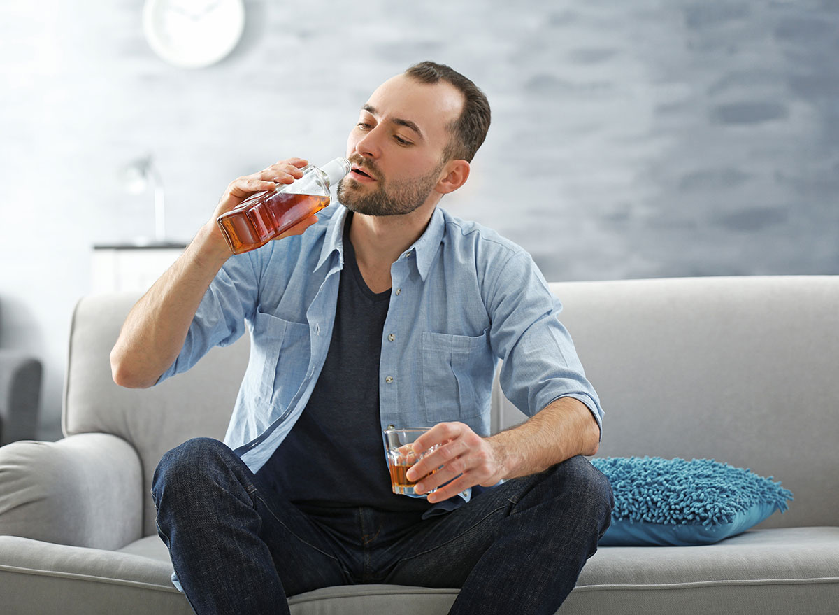 man drinking from liquor bottle - how does alcohol affect the brain