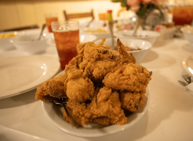 mrs wilkes' fried chicken on a plate.