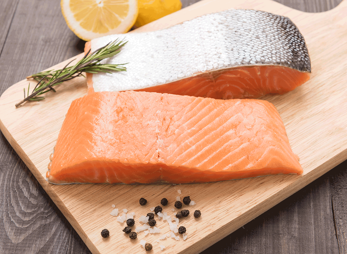 salmon fillets on cutting board with skin - muscle building foods