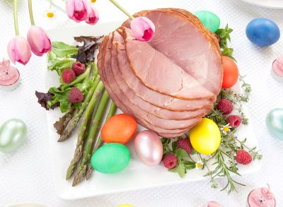 sliced easter table ham on serving plate